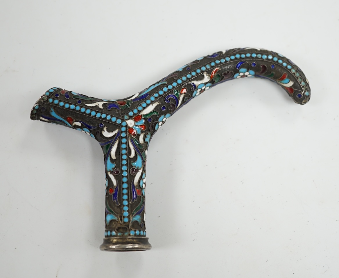 A Russian white metal and enamel walking stick handle, 12cm wide. Condition - fair to good